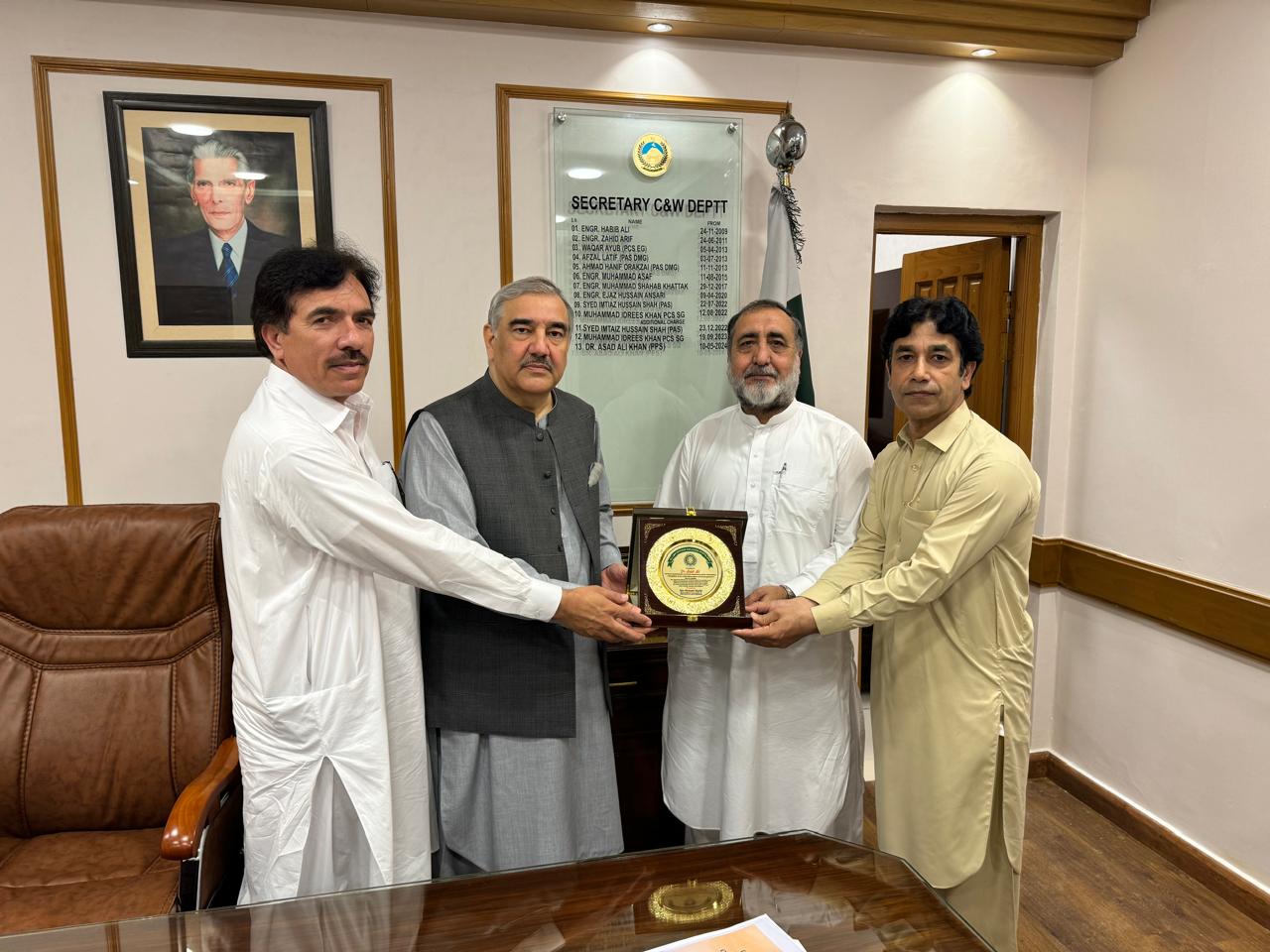 The secretary Communication and Works Department Dr. Asad Ali is being presented shield from Chief Engineer Centre Jamshed Ali and Sports Coordinator Ijaz Barki